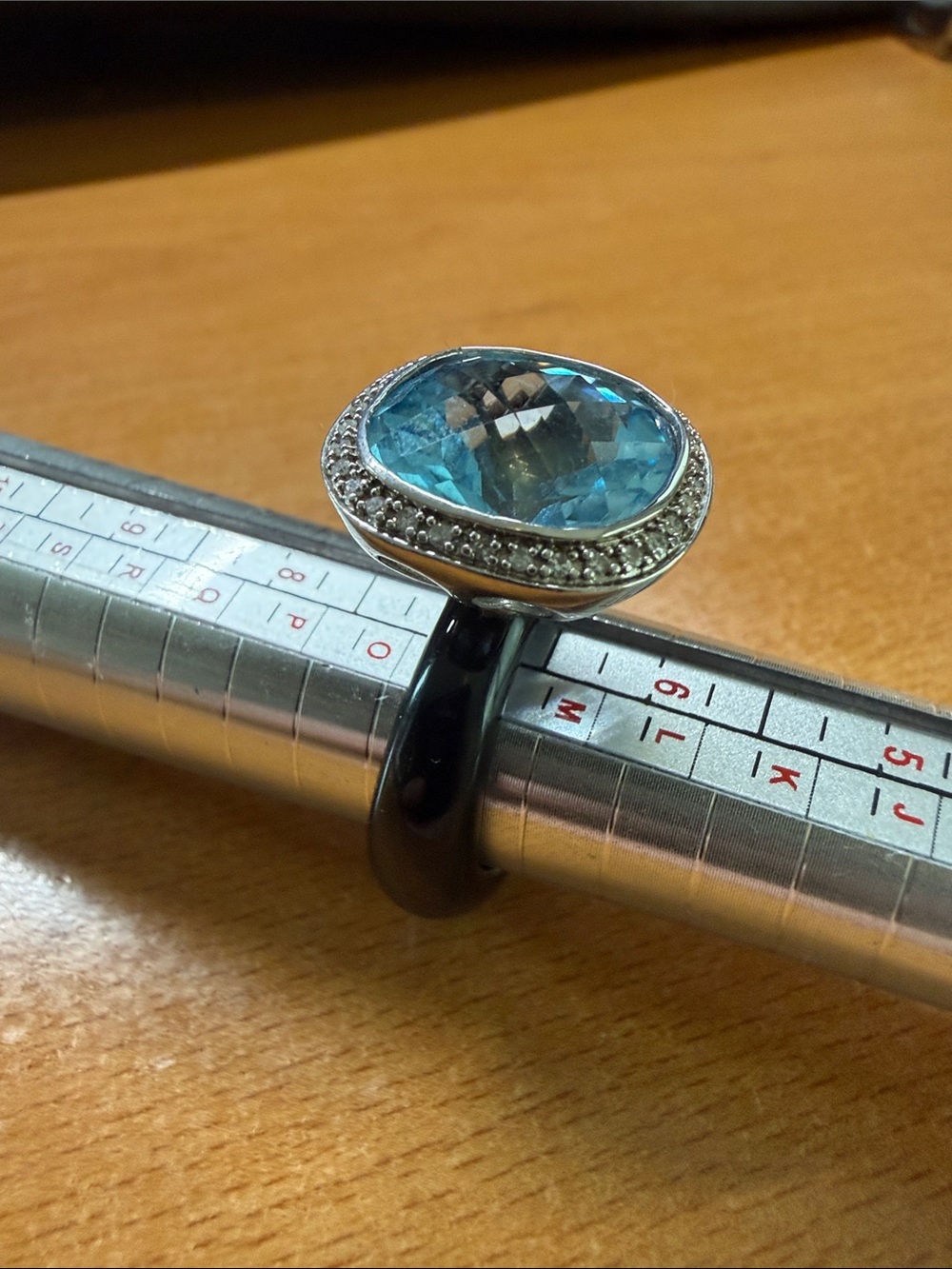 Silver and blue topaz ring with diamond accents, size 7